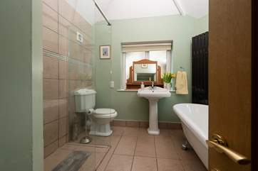 The ground floor bedroom has this en suite bathroom with separate shower cubicle.