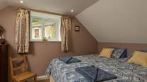 This is the master bedroom on the first floor. It looks out over some of the original farmstead buildings.