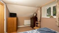 This bedroom has plenty of space for your things.