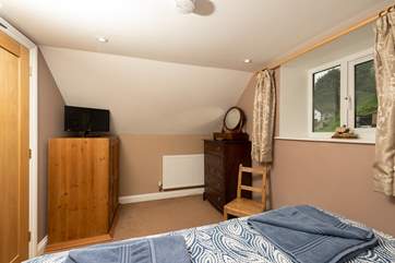 This bedroom has plenty of space for your things.