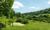 What a peaceful place to sit and relax. With the pond in front of you (please take care with children) and the valley stretching away down the hill. - Thumbnail Image