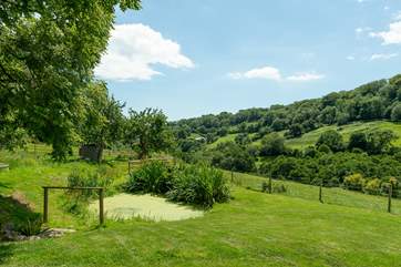 What a peaceful place to sit and relax. With the pond in front of you (please take care with children) and the valley stretching away down the hill.