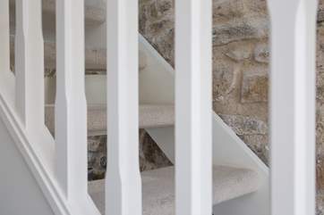 The open tread staircase up to the sitting/bedroom.
