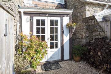 There is a little enclosed patio by the front door at the rear of the cottage.