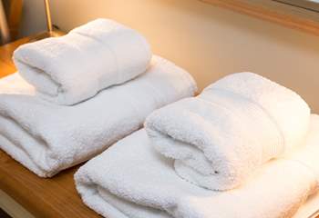 White fluffy towels are provided.