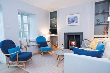 Retro furnishings suit the cottage wonderfully.