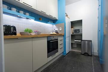 The kitchen has original slate flooring.