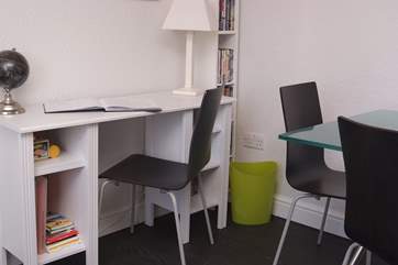 A working desk in the living area.