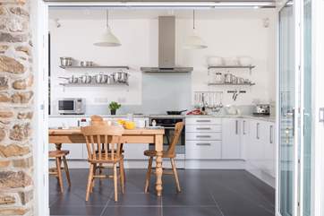 This fabulous kitchen/breakfast-room has folding doors to bring the outside in.