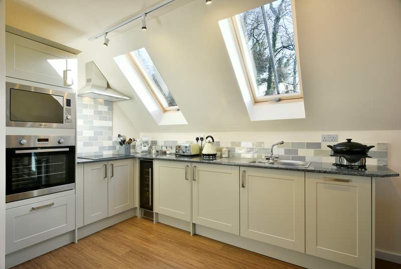 There is a super-contemporary kitchen fitted around this corner of the living space.