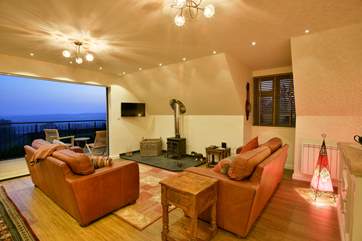 The sunset light washes into the spacious open plan living-area.