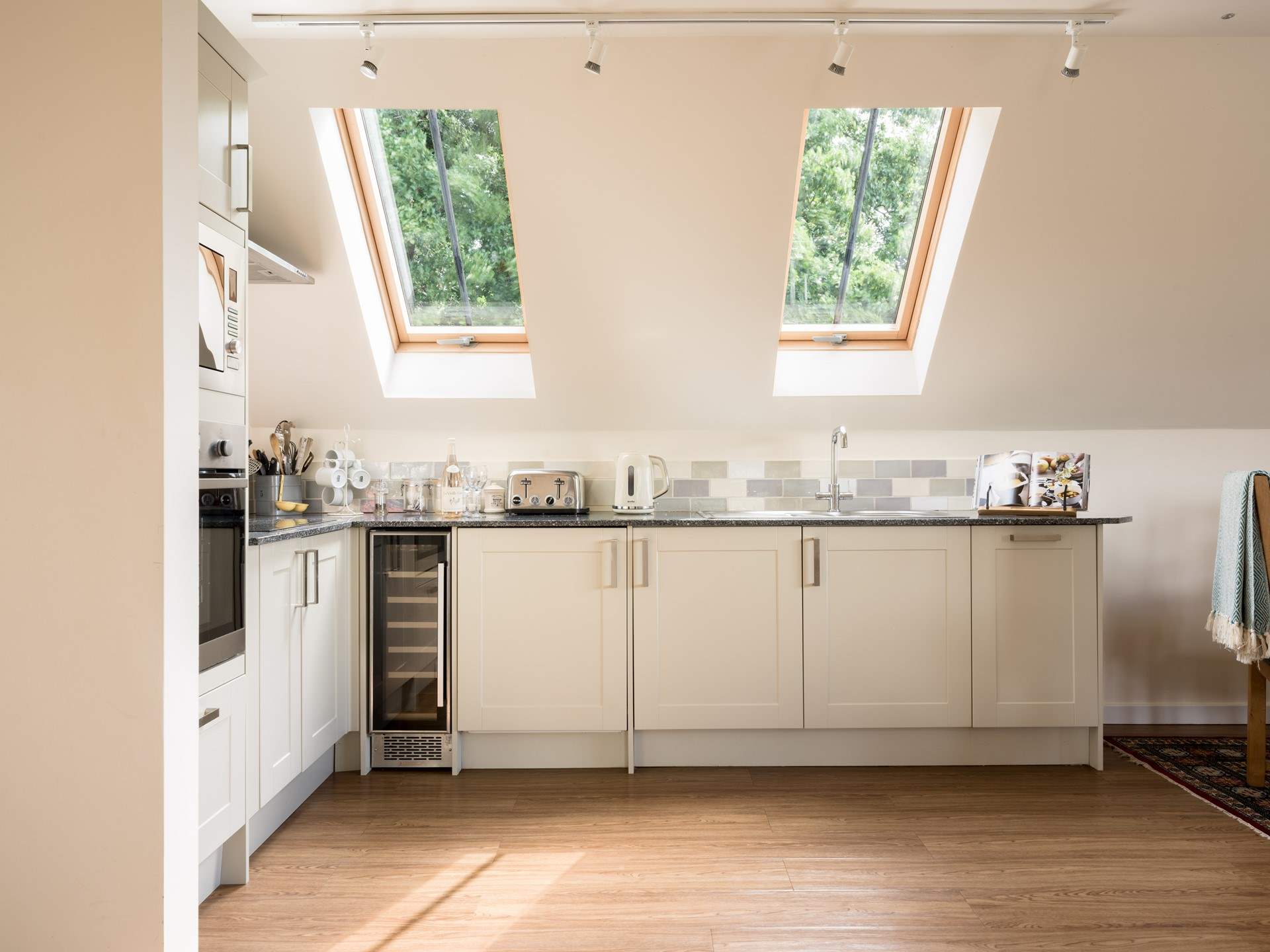 There is a super-contemporary kitchen fitted around this corner of the living space.