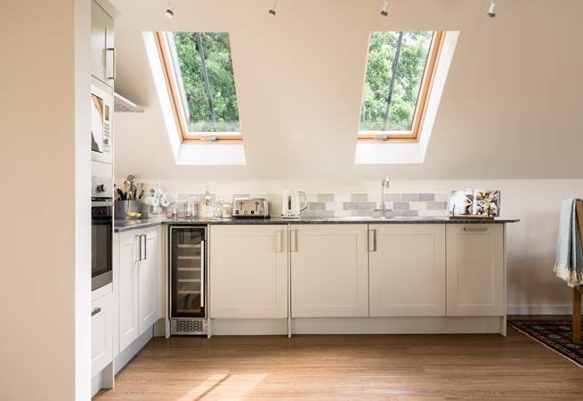There is a super-contemporary kitchen fitted around this corner of the living space.