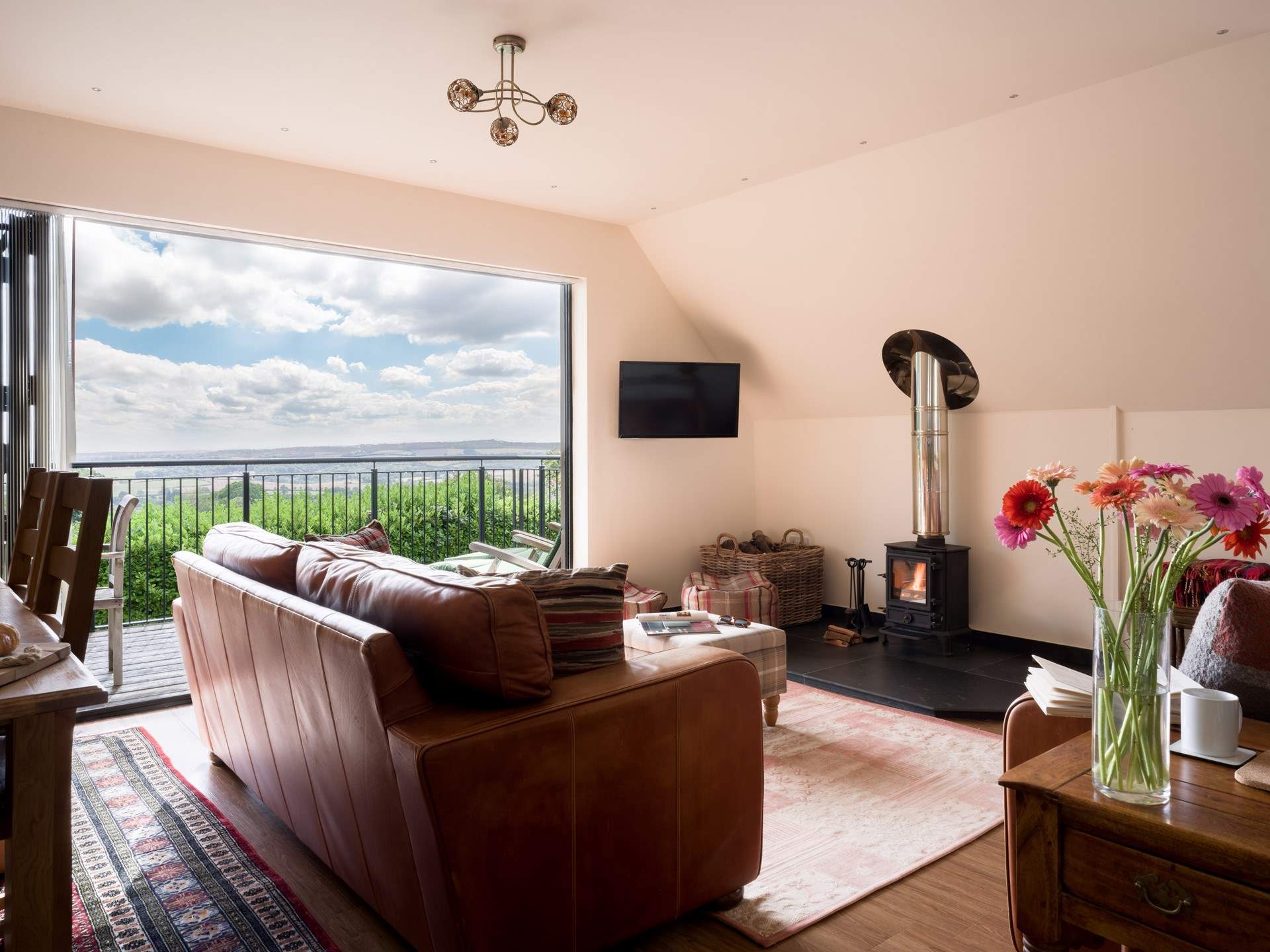 The wood burner completes this open yet cosy space perfectly