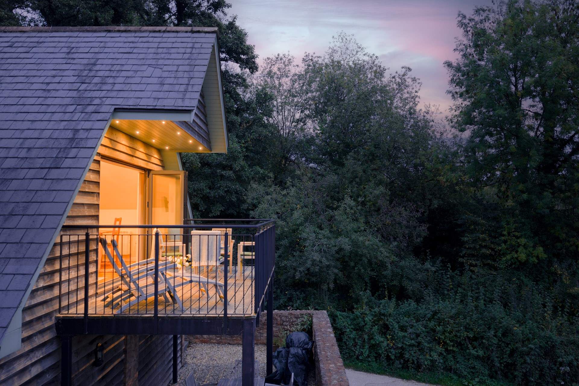 The lodge is extremely spacious and stunning as evening closes in.