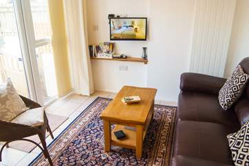 The TV is on a swivel arm which is very handy, and the double doors will open to a conservatory in 2021.