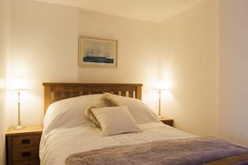 The bedroom is snug and cosy.