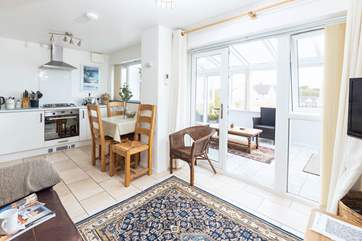 The light and airy living space leads out to the conservatory which in turn leads to the patio.
