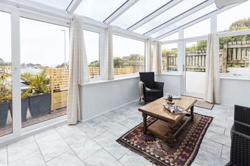 Relax in the light and airy conservatory.