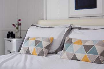 A comfy bed to dive into at the end of the day's adventures.