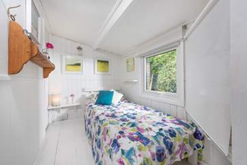 The single bedroom is at the back of the cabin.