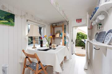 The dining-table sits under the eaves so please mind your head.