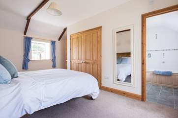 This double bedroom has plenty of storage and space.
