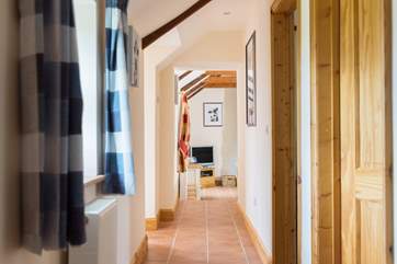 The bedrooms are found along the long and light hall.
