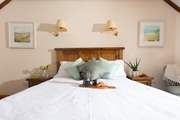 The solid wood five foot double bed in spacious bedroom 2 with lots of storage and an en suite bathroom.