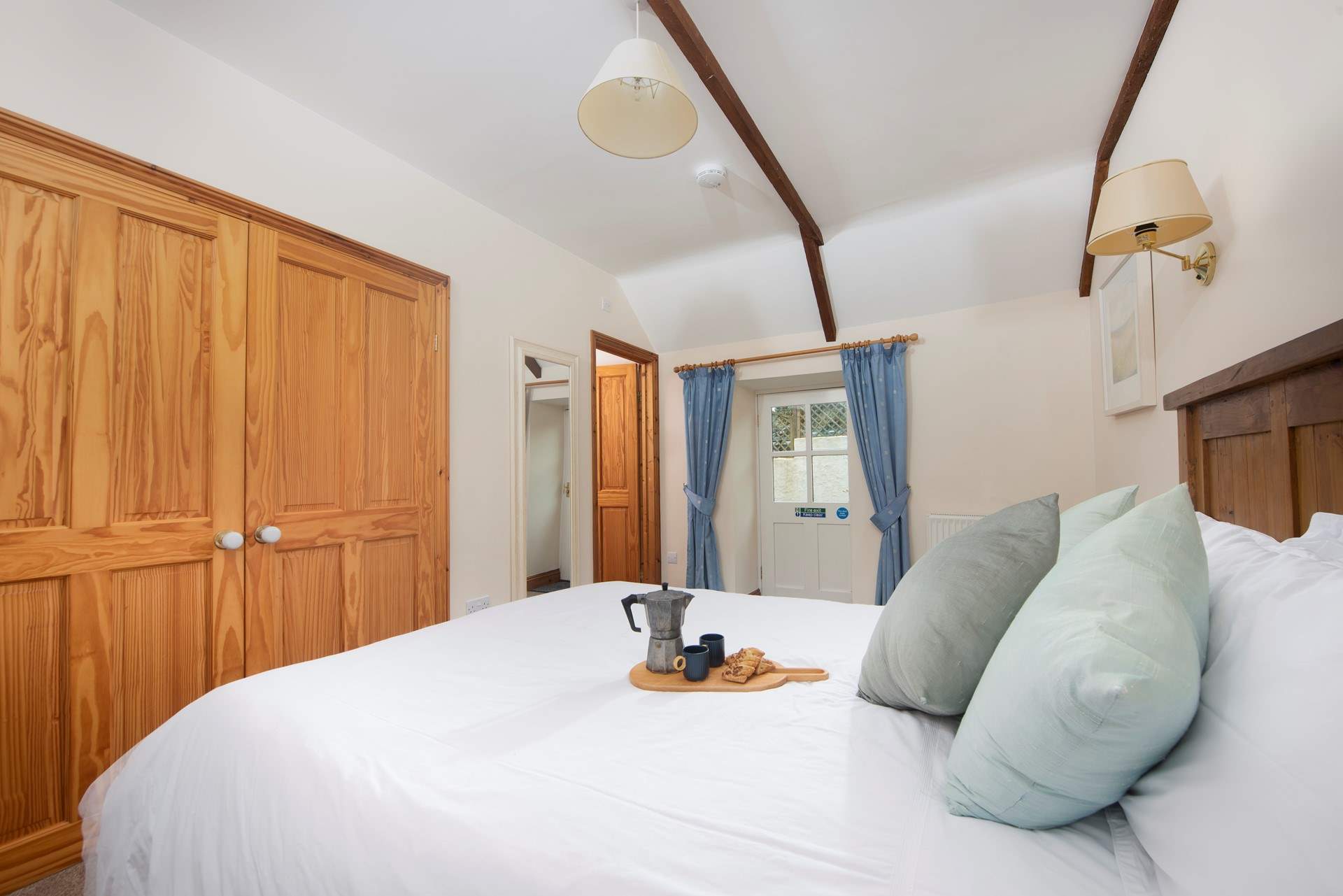 This double bedroom has plenty of storage and space.