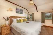 Bedroom 1 is both spacious and cosy.