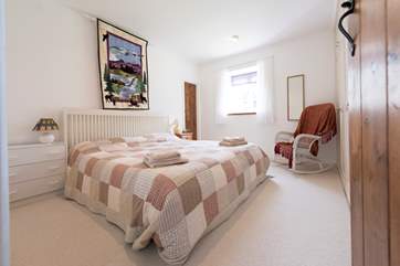 The master bedroom has a 5' double bed.