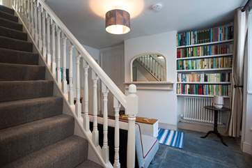 Stairs lead from the snug to the first floor.
