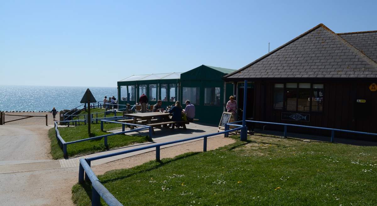 A perfect place to relax, the Hive Beach cafe at Burton Bradstock, serving fabulous locally caught seafood.