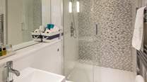 The family bathroom on the first floor has a double shower; plenty of space for sandy children.