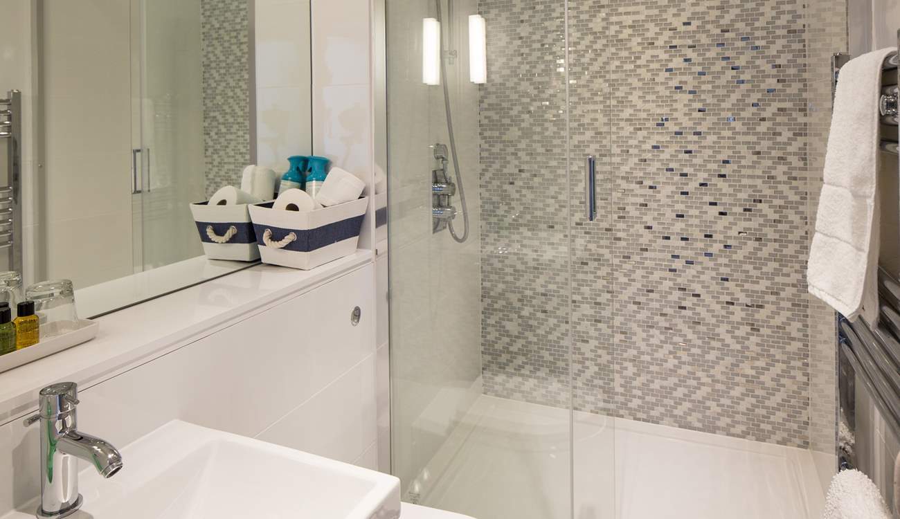 The family bathroom on the first floor has a double shower; plenty of space for sandy children.