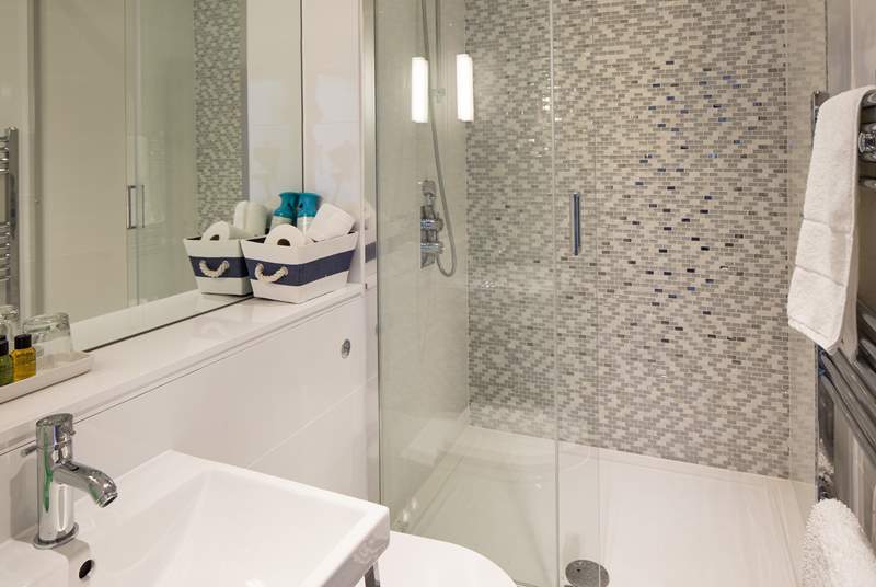 The family bathroom on the first floor has a double shower; plenty of space for sandy children.
