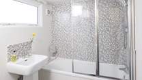 The ground floor bathroom has a large heated towel rail for toasty warm bathing.