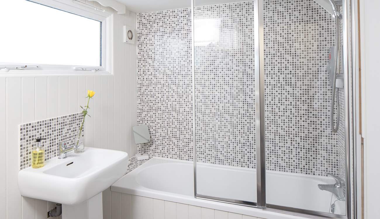 The ground floor bathroom has a large heated towel rail for toasty warm bathing.