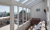 The fully glazed terrace is a great place to watch the changing seascape, whatever the weather. - Thumbnail Image