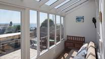 The fully glazed terrace is a great place to watch the changing seascape, whatever the weather.