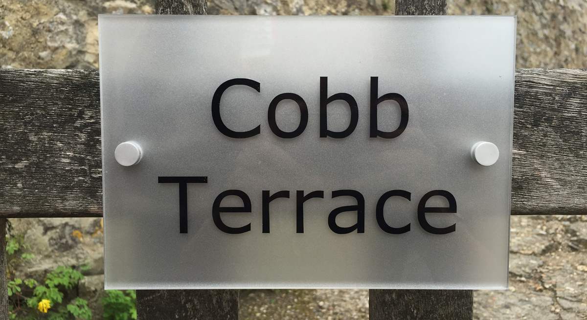 The sign on the gate. Cobb Cottage is through the gate and a short way up the little path on the right.