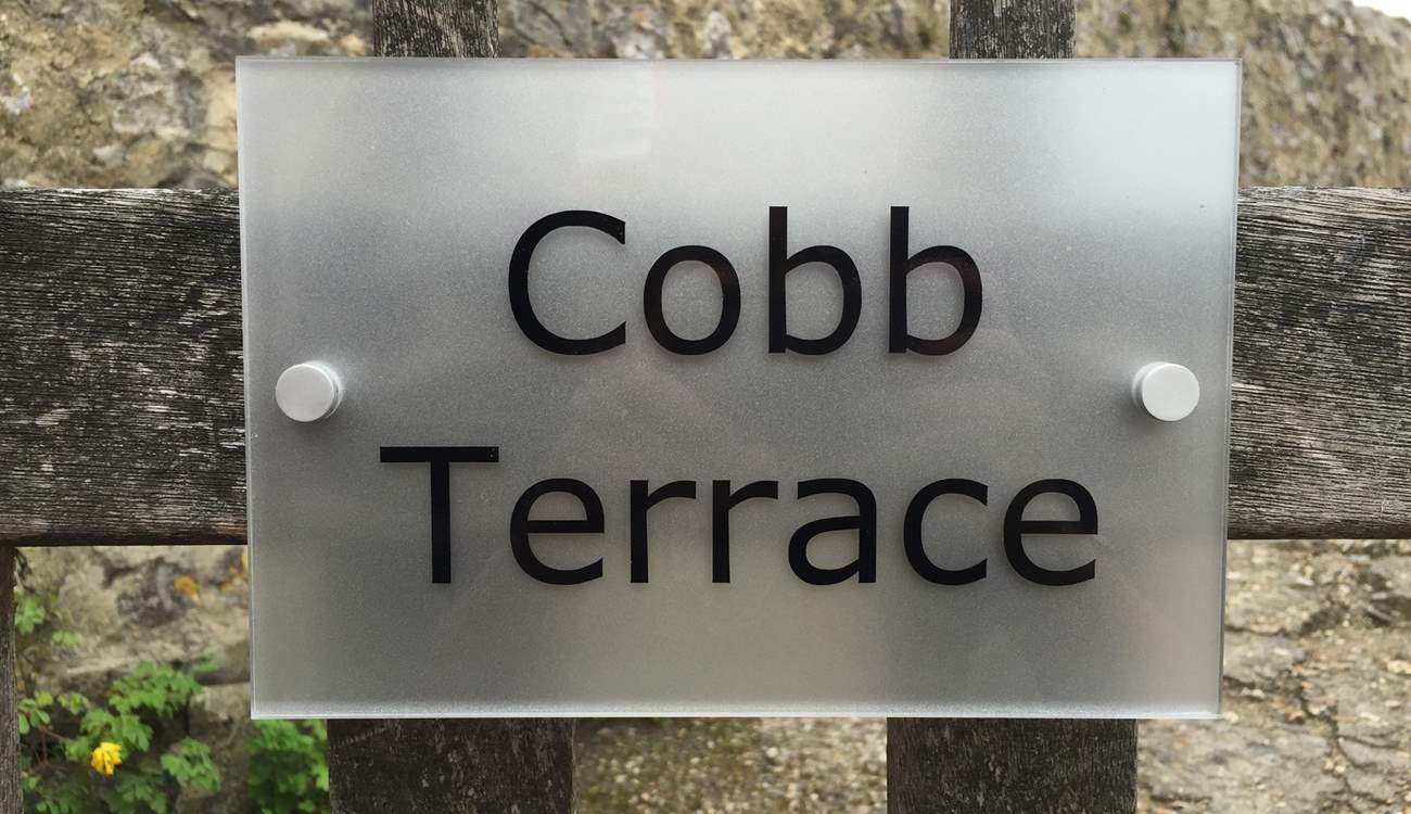The sign on the gate. Cobb Cottage is through the gate and a short way up the little path on the right.