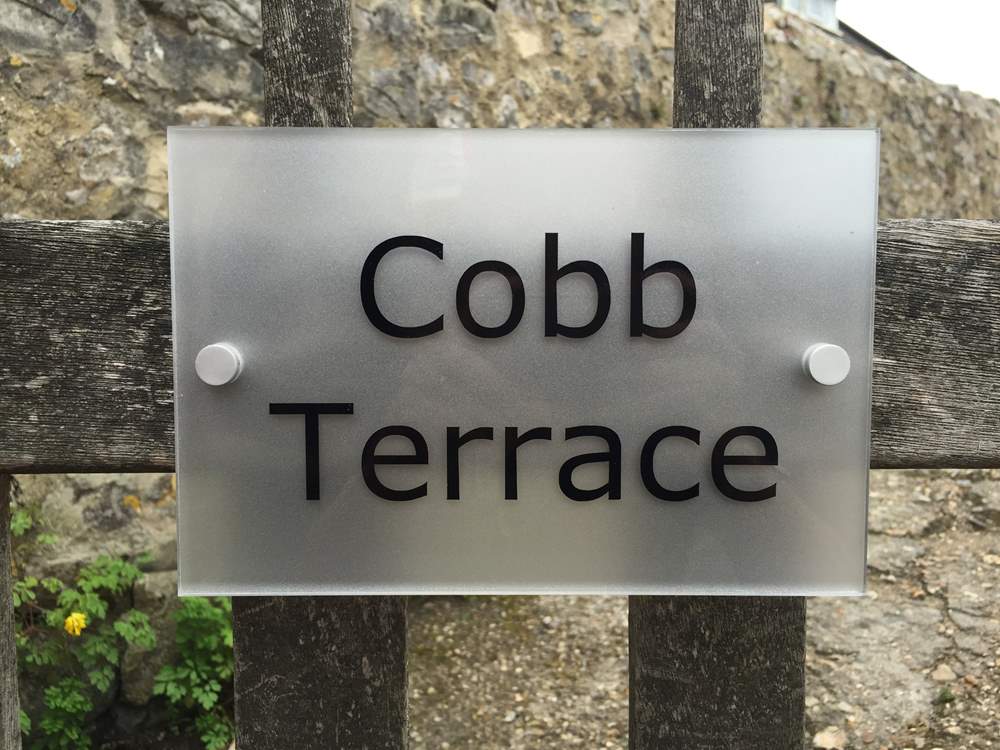 The sign on the gate. Cobb Cottage is through the gate and a short way up the little path on the right.
