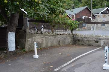 This is the marked parking space for Cobb Cottage, the space beside the tree marked with white paint. The cottage is just above accessed via a footpath.