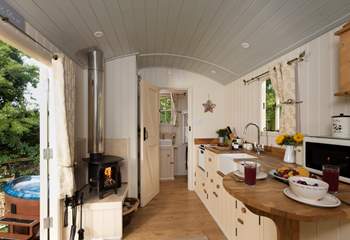 Surprisingly spacious and beautifully fitted inside, there is even under-floor heating to supplement the wood-burner in the cooler months.