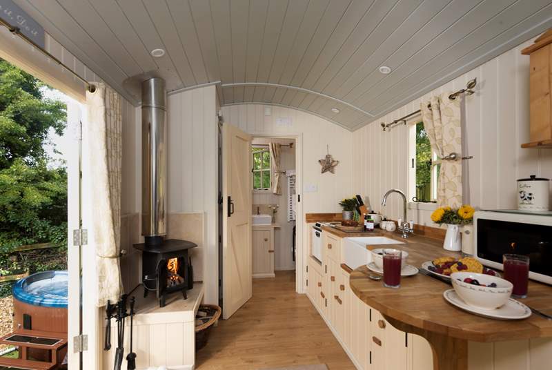 Surprisingly spacious and beautifully fitted inside, there is even under-floor heating to supplement the wood-burner in the cooler months.