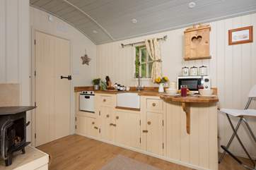 The kitchen is fully fitted with hob and mini oven, microwave, toaster and kettle too.