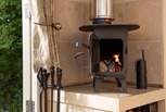 The cute little wood-burning stove adds extra warmth and cosiness.