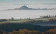 Why not visit iconic Glastonbury with is enchanting tor? The views from the top are simply spellbinding. 